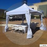 10x10 Pop-Up Canopy Rentals in Down Town Dallas creating shade for a couple of tables and chairs